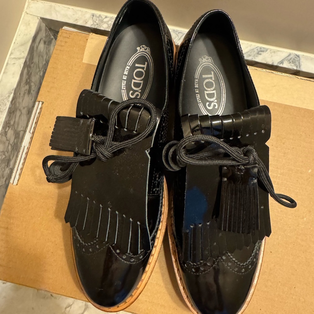Tod's Glossy Black Leather Fringe Loafers